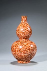 AN IRON RED 'HUNDRED BLESSINGS' VASE