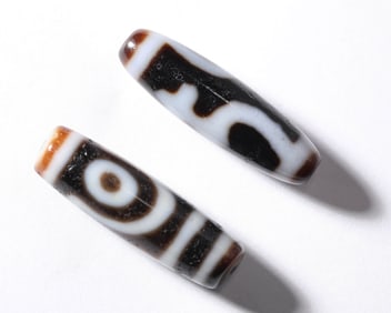 A PAIR OF DZI BEADS