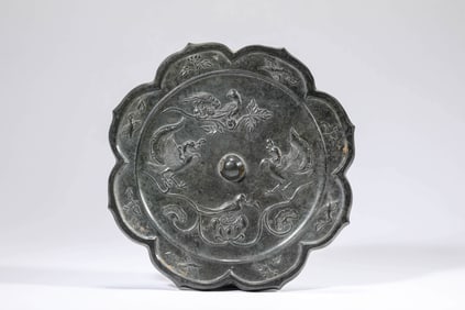 A BRONZE 'FLOWER AND BIRD' MIRROR