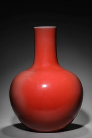 A RED GLAZED GLOBULAR VASE