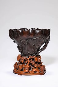 A WOODEN LOTUS LEAF RHINOCEROS HORN CUP