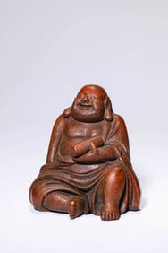 A WOODEN FIGURE
