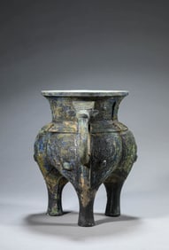 A BRONZE 'TAOTIE' JIA