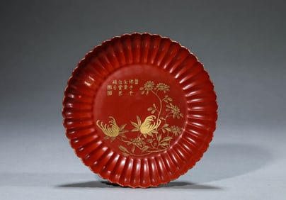 A CORAL RED GROUND GILDED 'LONGEVITY' CHRYSANTHEMUM FORM DISH