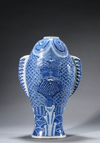 A BLUE AND WHITE FISH FORM VASE
