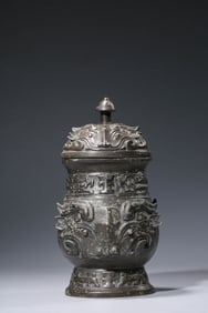 A BRONZE 'ANIMAL MASK' Lü YI YOU