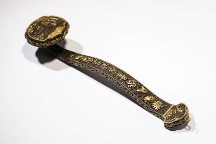 A BRONZE 'EIGHT TREASURES' RUYI SCEPTRE