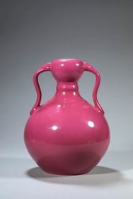 A RUBY RED GROUND 'DOUBLE RUYI' JAR