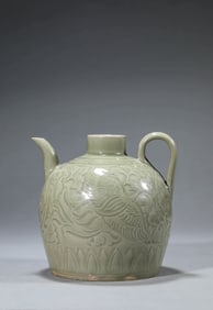 A YAOZHOU TYPE 'PHOENIX IN FLOWERS' EWER
