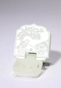 A JADE 'PEACE AND PROSPERITY' BELT BUCKLE
