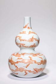 AN IRON RED 'FLOATING' VASE