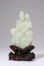 A JADE CARVING OF RELAXED AVALOKITESHVARA