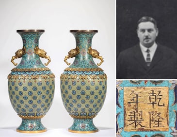 A CLOISONNé ENAMEL 'DRAGON' REVOLVING VASE WITH ELEPHANT HANDLES