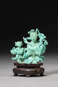 A TURQUOISE CARVING OF FIGURE