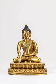 A GILT-BRONZE FIGURE OF SHAKYAMUNI