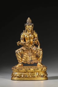 A GILT-BRONZE FIGURE OF BUDDHA