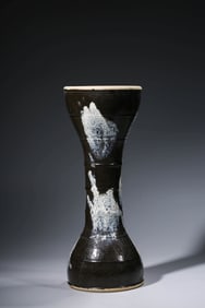 A BLACK-GLAZED VASE