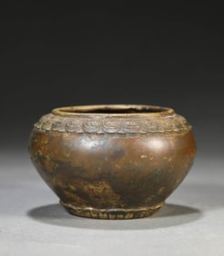 A BRONZE LOTUS-FOOT BOWL