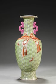 AN IRON-RED GREEN-GROUND 'LONGEVITY AND BAMBOO' VASE