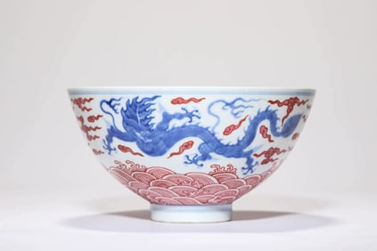 A BLUE AND WHITE WITH IRON-RED 'DRAGON-AMONG-WAVES' BOWL