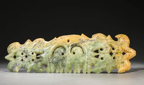 A JADE 'CLOUD-FORM' PENDANT