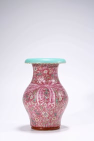 A RUBY RED GROUND FAMILLE-ROSE 'LONGEVITY AND FLOWERS' WRAPPED VASE