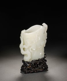 A WHITE JADE 'MAGPIE-ON-PLUM' JUE CUP