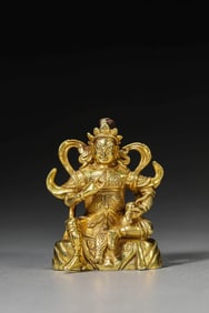 A GILT-SILVER FIGURE OF YELLOW JAMBHALA
