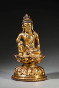 A GILT-BRONZE FIGURE OF RELAXED AVALOKITESHVARA