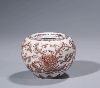 AN UNDERGLAZE-RED APPLE-SHAPED JAR