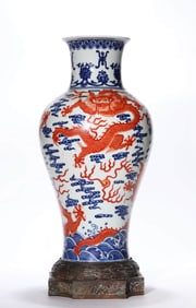 A BLUE AND WHITE WITH UNDERGLAZE-RED 'DRAGON-AMONG-WAVES AND AUSPICIOUS CLOUDS' VASE