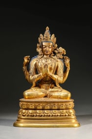 A GILT-BRONZE FOUR-ARMED AVALOKITESHVARA
