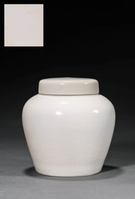 A WHITE-GLAZED INCISED 'DRAGON' COVERED JAR