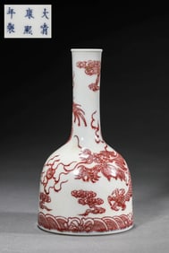 AN UNDERGLAZED RED 'CLOUD AND DRAGON' VASE