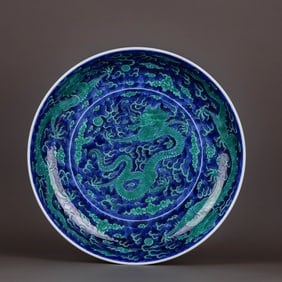 A BLUE AND WHITE, GREEN-ENAMELLED 'CLOUD AND DRAGON' DISH