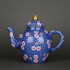 A BLUE-GROUND FAMILLE ROSE 'PRUNUS' TEAPOT