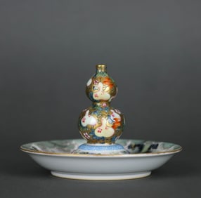 A GOLD-GROUND FAMILLE ROSE 'AUSPICIOUS ' INCENSE HOLDER