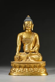 A GILT-BRONZE FIGURE OF SHAKYAMUNI