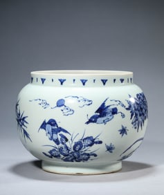 A BLUE AND WHITE 'BIRD-AND-ROCK' JAR