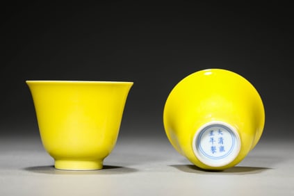 A PAIR OF LEMON-YELLOW GROUND CUPS