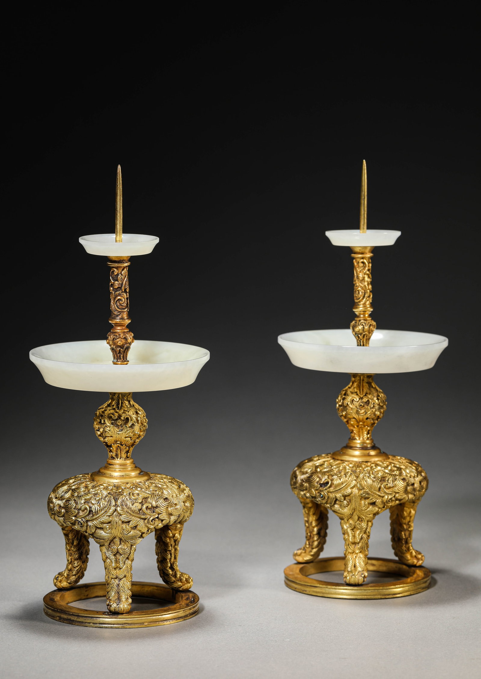 A PAIR OF GILT-BRONZE OIL LAMPS WITH JADE INLAY: A PAIR OF GILT-BRONZE OIL LAMPS WITH JADE INLAY Dimensions: Width: 10 cm (3.94 in) x Height: 23.5 cm (9.25 in). All measurements are approximate.