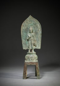 A BRONZE FIGURE OF BUDDHA