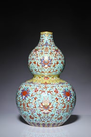 A FAMILLE ROSE WITH GILT-DECORATED 'FLORAL AND SHOU CHARACTERS' GOURD-SHAPED VASE