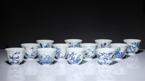 A BLUE AND WHITE WITH DOUCAI 'FLOWER MONTHS' CUP