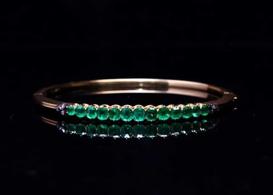 GOLD AND SILVER EMERALD BANGLE