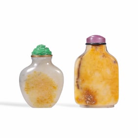 A SET OF SKIN-INLAID HETIAN JADE SNUFF BOTTLES