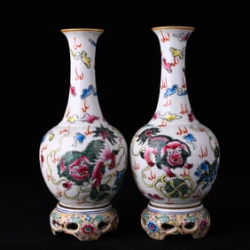 A FAMILLE-ROSE 'LION PLAYING WITH BROCADE BALL' REVOLVING VASE