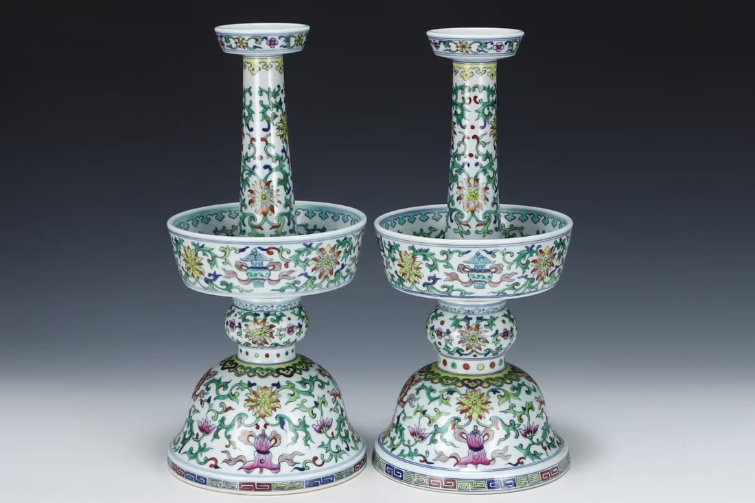 A PAIR OF DOUCAI 'INTERLOCKING LOTUS' CANDLESTICKS: A PAIR OF DOUCAI 'INTERLOCKING LOTUS' CANDLESTICKS Dimensions: 43.7 x 19.8 cm (17.20 x 7.80 in.). All measurements are approximate.