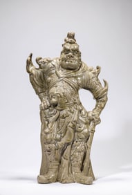A CELADON GUARDIAN FIGURE