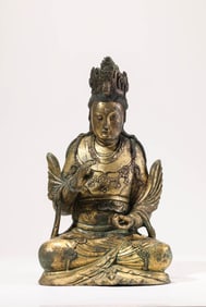 A GILT-BRONZE SEATED FIGURE OF AVALOKITESHVARA